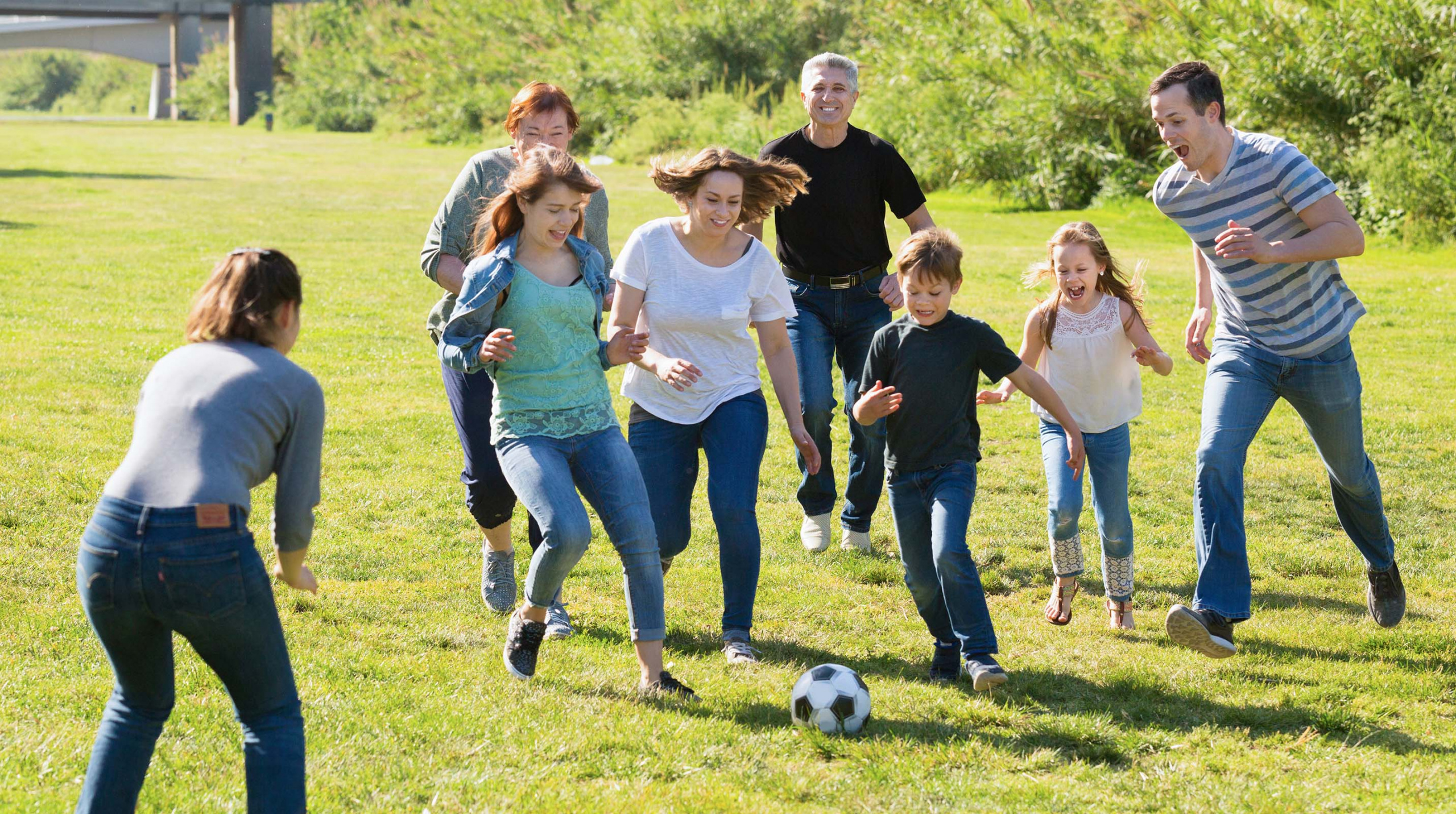 Happy,Cheerful,Smiling,People,Of,Different,Ages,Playing,Football,On